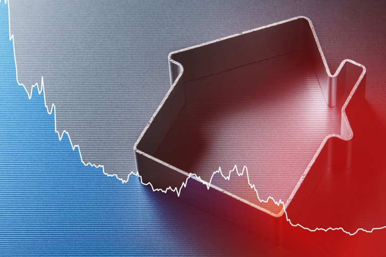 Real Estate Market Decline Concept with Falling Chart and House.