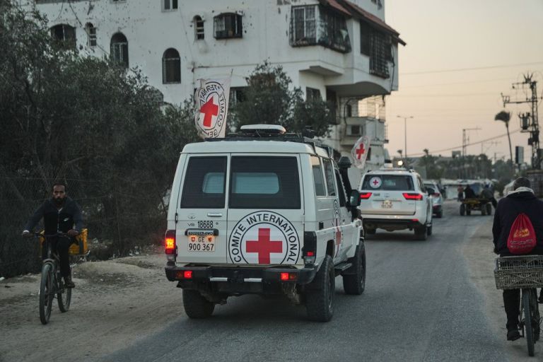 A Red Cross vehicle carrying the remains of alleged hostages taken by Hamas.