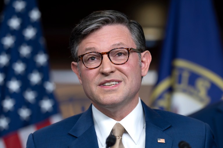 Mike Johnson takes questions during a press conference.