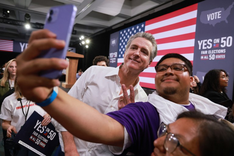 Gov. Gavin Newsom meets with attendees during a campaign event on Proposition 50, Saturday, Nov. 1, 2025, in Los Angeles. (AP Photo/Ethan Swope)