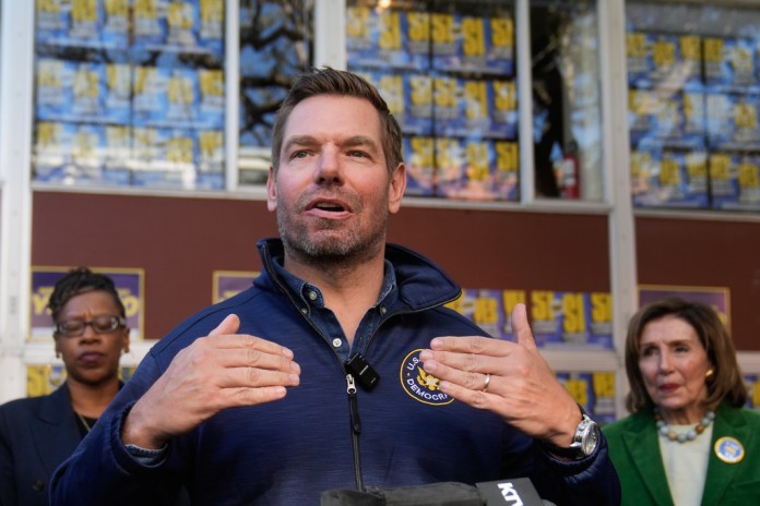Rep. Eric Swalwell, D-Calif., speaks to reporters after a campaign event on Proposition 50 in San Francisco, Monday, Nov. 3, 2025. (AP Photo/Jeff Chiu)