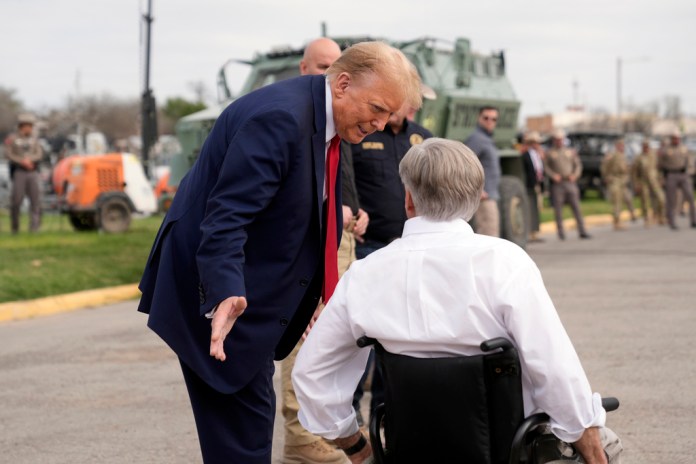 President Donald Trump talks with Texas Gov. Greg Abbott.