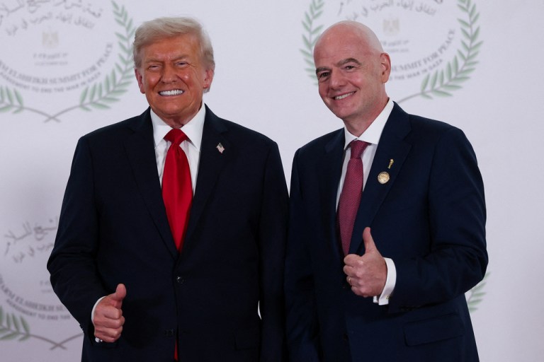 Trump and FIFA president Gianni Infantino pose for a photo.