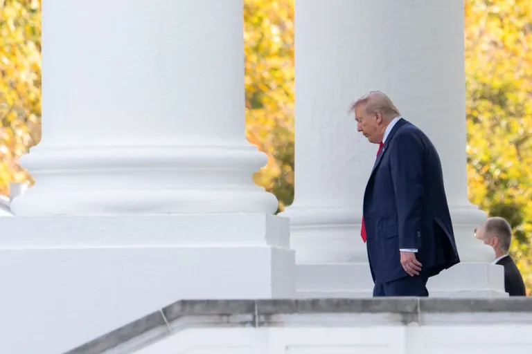 Trump walks outside.