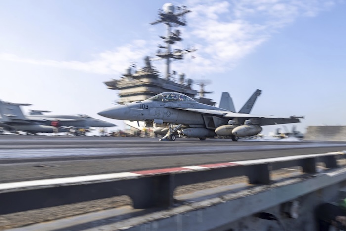 US aircraft landing on an aircraft carrier