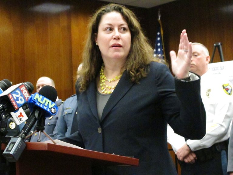 First New Jersey Assistant Attorney General Jennifer Davenport speaks at a press conference Friday, March 9, 2018, in Toms River, N.J., to announce drug charges against 31 people in New Jersey, New York and one foreign country that he would not identify. (AP Photo/Wayne Parry)
