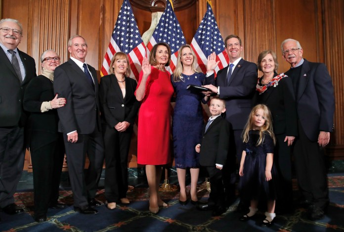 House Speaker Nancy Pelosi (D-CA) poses during a ceremonial swearing-in with Rep. Mike Levin (D-CA).