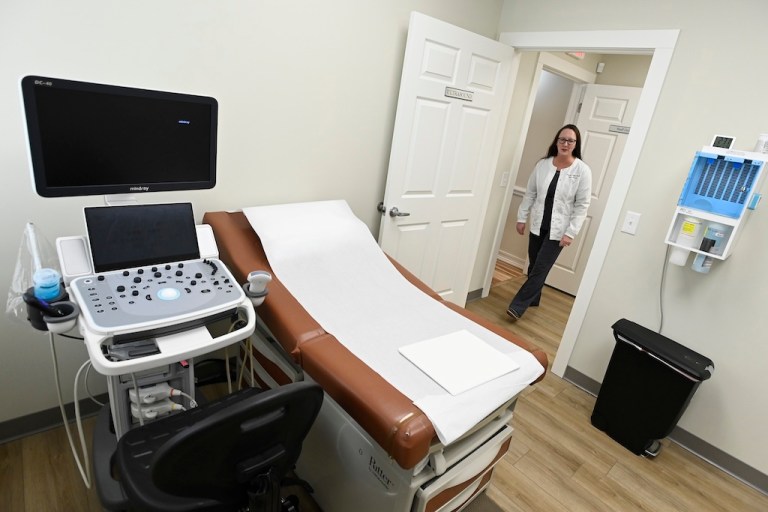 Portico Crisis Pregnancy Center nurse manager Diandra Bell enters one of two ultrasound rooms Jan. 26, 2022, in Murfreesboro, Tenn. (AP Photo/Mark Zaleski)