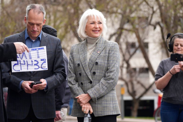 Mesa County clerk Tina Peters, who was indicted in March on 11 felony and misdemeanor charges related to allegations she and others tampered with secure voting equipment and software, talks to well-wishers at a rally staged to voice concerns about free and fair elections on the west steps of the State Capitol Tuesday, April 5, 2022, in downtown Denver. Peters and Mike Lindell, MyPillow chief executive officer, spoke at the rally, which drew several hundred attendees.