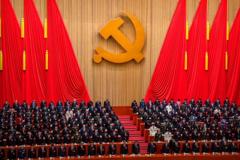 Delegates stand for a moment of silence during the opening ceremony of the 20th National Congress of China's ruling Communist Party at the Great Hall of the People in Beijing, China.