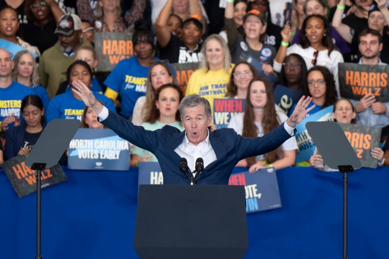 Gov. Roy Cooper, D-N.C., arrives onstage before Democratic presidential nominee Vice President Kamala Harris arrives to speak at a campaign rally, Wednesday, Oct. 30, 2024, in Raleigh, N.C. (AP Photo/Allison Joyce)