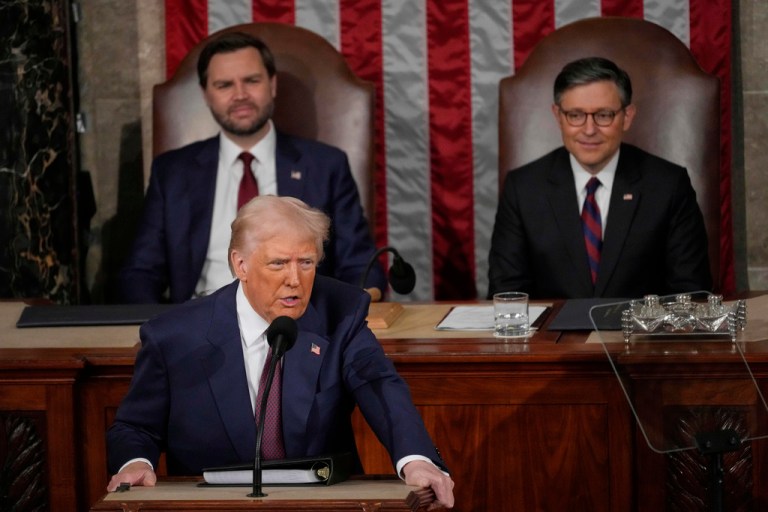 President Donald Trump talks about Greenland as he addresses a joint session of Congress in the House chamber at the Capitol, as Vice President JD Vance and House Speaker Mike Johnson (R-LA) listen.