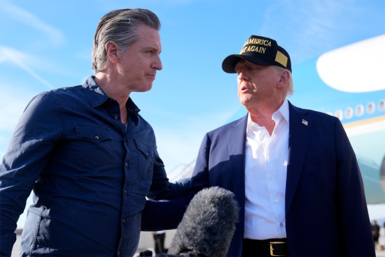 President Donald Trump talks with California Gov. Gavin Newsom