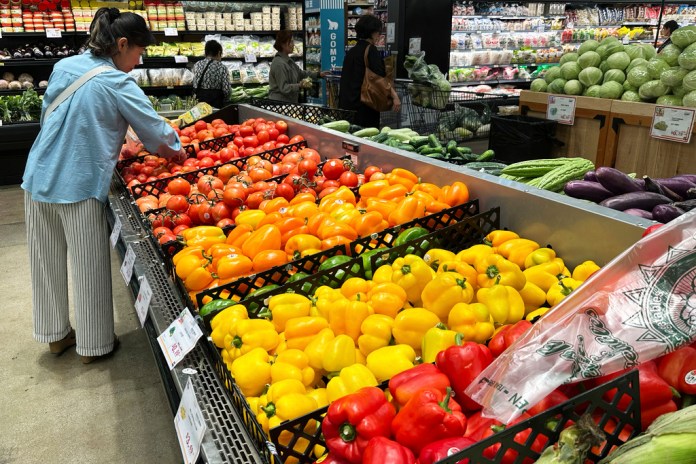 A person shops at a grocery store.