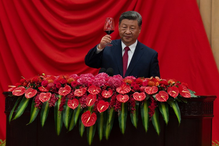 Chinese President Xi Jinping raises his glass to toasts after speaking at the National Day Reception at the Great Hall of the People on the eve of the 76th anniversary of the founding of the People's Republic of China in Beijing, Tuesday, Sept. 30, 2025. (AP Photo/Ng Han Guan)