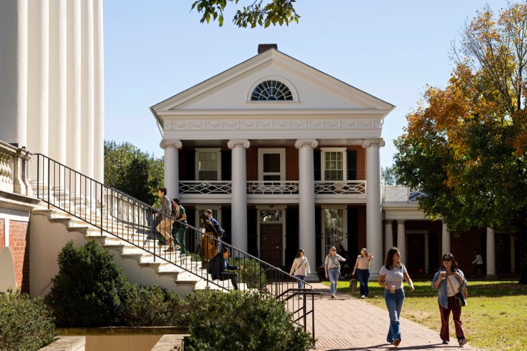 People climb steps to the Rotunda at the University of Virginia in Charlottesville, Va.