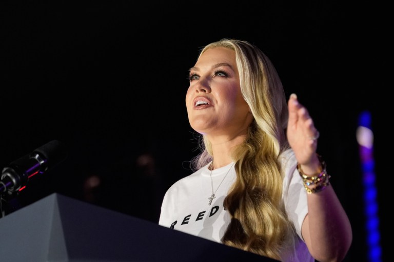 Erika Kirk speaks at a podium