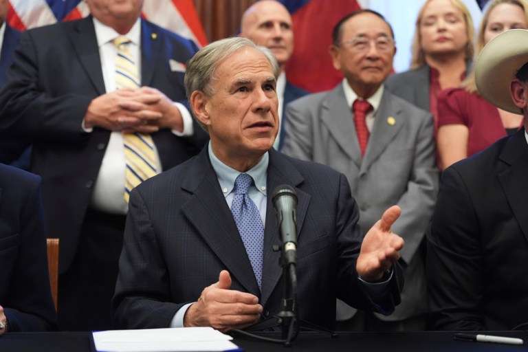 Gov. Greg Abbott (R-TX) speaks to the media following a bill signing as Texas senators debate a bill on a redrawn congressional map during a special session in the Senate chamber at the Texas Capitol in Austin, Texas.