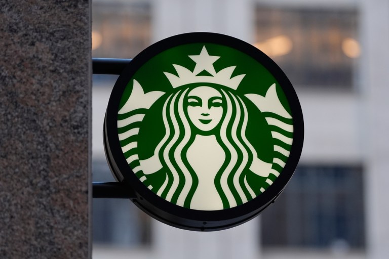 The Starbucks logo is displayed on a coffee shop.