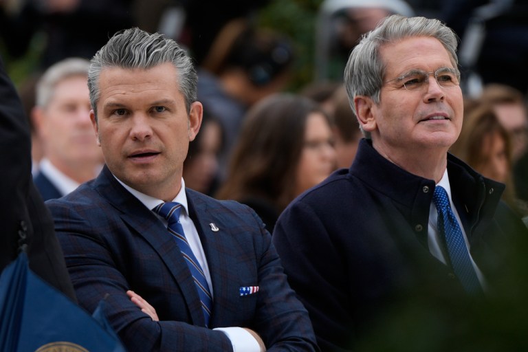 Defense Secretary Pete Hegseth, left, and Treasury Secretary Scott Bessent, right, arrive for the national Thanksgiving turkey pardoning ceremony in the Rose Garden of the White House, Tuesday, Nov. 25, 2025, in Washington. (AP Photo/Julia Demaree Nikhinson)