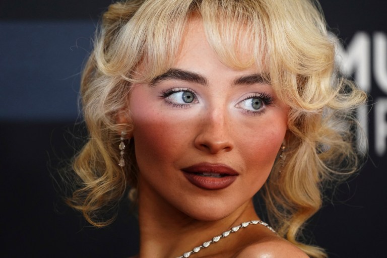 Sabrina Carpenter poses for photos.