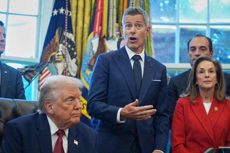 Transportation Secretary Sean Duffy speaks as President Donald Trump looks on, during an event on fuel economy standards in the Oval Office of the White House, Wednesday, Dec. 3, 2025, in Washington.