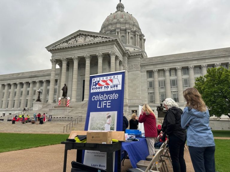 Abortion opponents prepare for a rally at the Missouri Capitol.