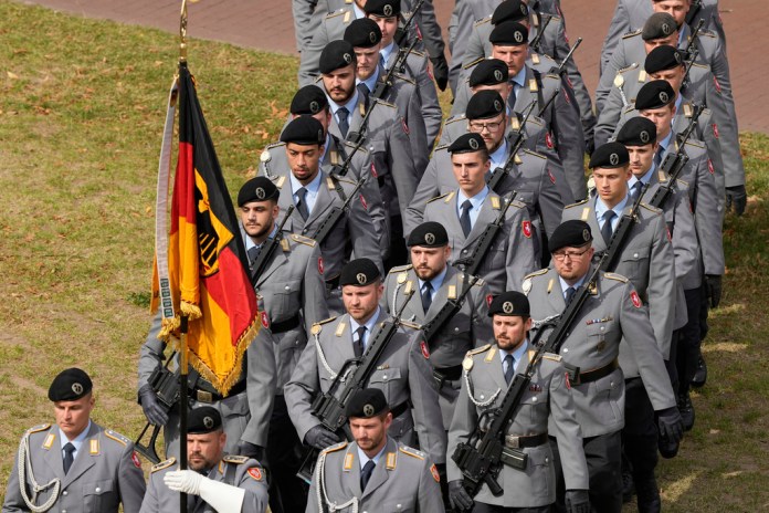 New recruits of the German Army Bundeswehr attend a ceremony.