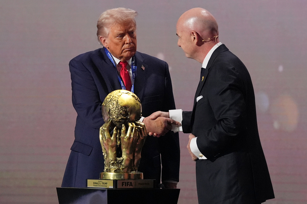 Trump finally gets his peace prize as FIFA hands him inaugural award at World Cup draw
