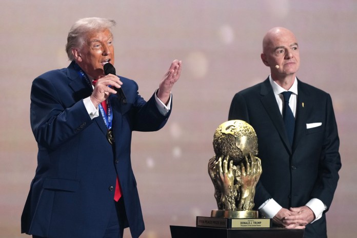 President Donald Trump speaks after being presented with the FIFA Peace Prize.