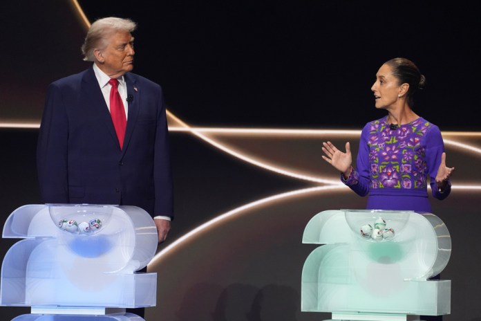 Mexican President Claudia Sheinbaum speaks as President Donald Trump stands onstage.
