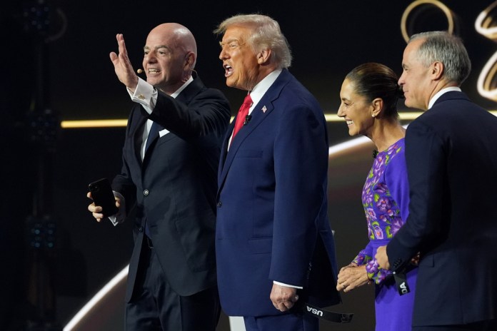 Canadian Prime Minister Mark Carney, Mexican President Claudia Sheinbaum, President Donald Trump, and FIFA President Gianni Infantino react during the draw for the 2026 World Cup.