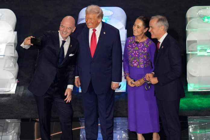 FIFA President Gianni Infantino takes a selfie with President Donald Trump, Mexican President Claudia Sheinbaum, and Canadian Prime Minister Mark Carney.