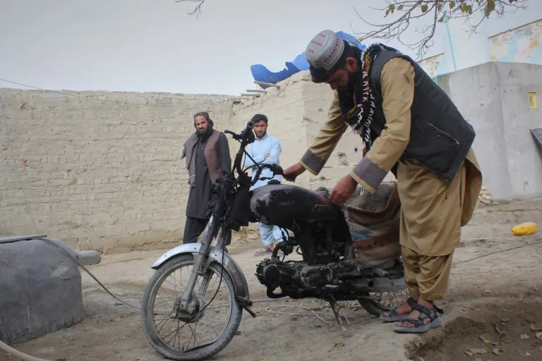 A man inspects a motorcycle damaged during an overnight exchange of fire between Afghan and Pakistani forces along the border in Spin Boldak, Kandahar province, Afghanistan, Saturday, Dec. 6, 2025.