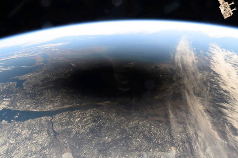 The Moon's shadow covering portions of Canada and the U.S. during a total solar eclipse