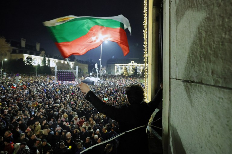 A student waves a Bulgarian flag.