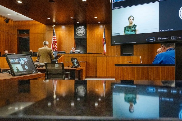 FILE - Defense attorney Greg Skordas, left, speaks before Judge Tony Graf, background, in Provo, Utah, as Tyler Robinson, in monitor at right, accused of fatally shooting Charlie Kirk, attends the court hearing virtually from prison on Tuesday, Sept. 16, 2025. (Scott G Winterton/The Deseret News via AP, Pool, File)