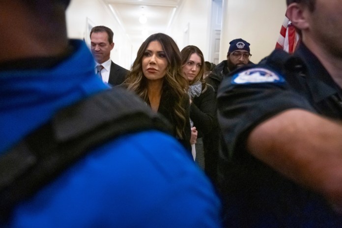 Homeland Security Secretary Kristi Noem leaves a hearing