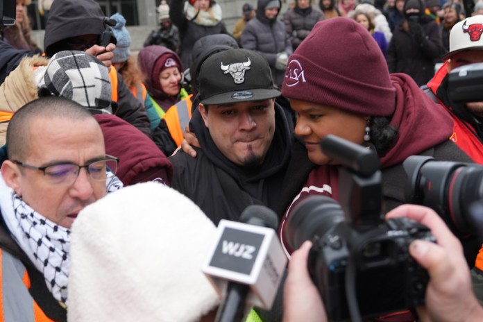 Kilmar Abrego Garcia leaves with Lydia Walther-Rodriguez of Casa in Maryland, after a mandatory check at the Immigration and Customs Enforcement office in Baltimore, Friday, Dec. 12, 2025, after he was released from detention on Thursday under a judge's order. (AP Photo/Stephanie Scarbrough)