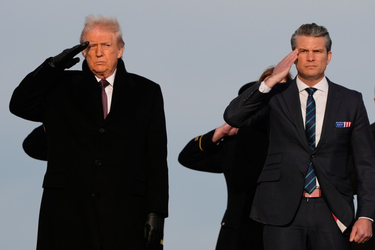President Donald Trump and War Secretary Pete Hegseth salute.