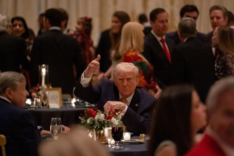 President Donald Trump, first lady Melania Trump, far left, and her father Viktor Knavs attend Christmas Eve dinner at his Mar-a-Lago club, Wednesday, Dec. 24, 2025, in Palm Beach, Fla. (AP Photo/Alex Brandon)