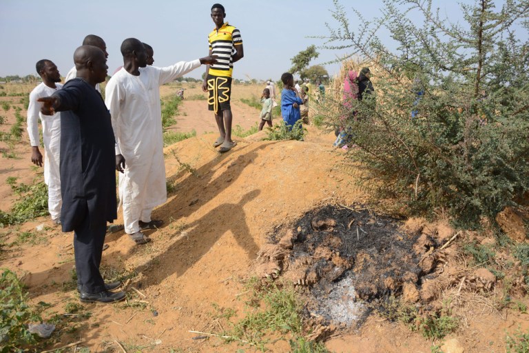 People visit the site of a U.S. airstrike in Northwest, Jabo, Nigeria, Friday, Dec. 26, 2025.