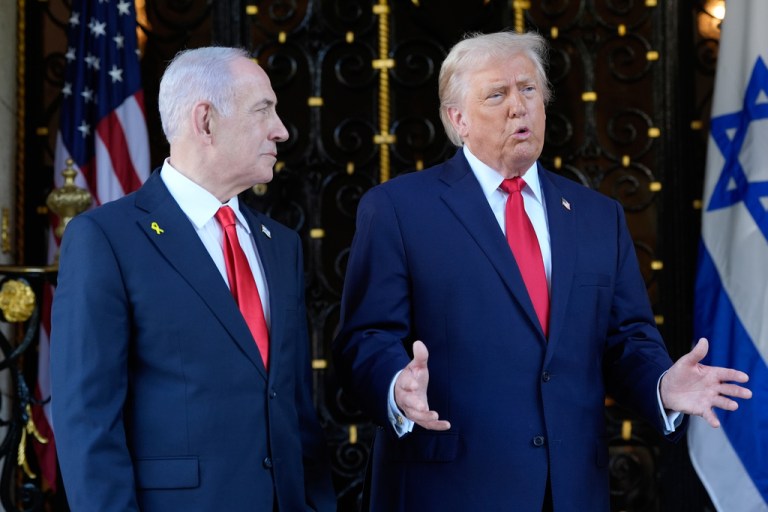 President Donald Trump speaks to reporters as he greets Israeli Prime Minister Benjamin Netanyahu at his Mar-a-Lago club.
