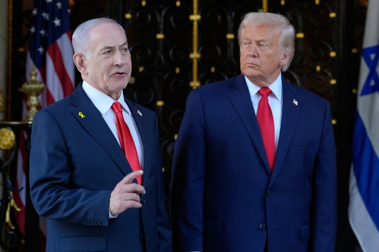 President Donald Trump listens as Israel's Prime Minister Benjamin Netanyahu speaks during an arrival at his Mar-a-Lago club, Monday, Dec. 29, 2025, in Palm Beach, Fla.