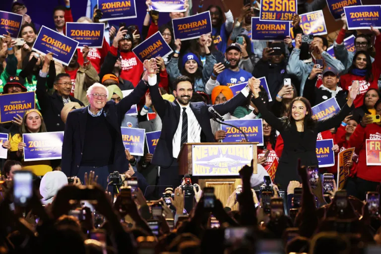 Sen. Bernie Sanders (I-VT), New York mayoral candidate Zohran Mamdani, and Rep. Alexandria Ocasio-Cortez (D-NY) appear on stage during a rally.