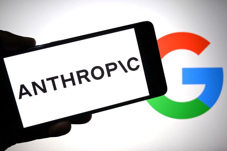 Anthropic logo is seen displayed on a smartphone with a Google logo in the background.