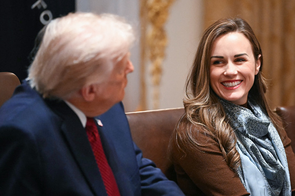 (L/R) US President Donald Trump speaks as Meryl Kennedy, CEO of 4Sisters Rice, looks on during a roundtable event to discuss aid for farmers, in the Cabinet Room of the White House in Washington, DC, on December 8, 2025. President Trump is announcing a $12 billion aid package for US farmers, targeting a key support base hit by his trade policies. Since Trump's return to the White House in January, many US farmers have been battered by impacts of his wide-ranging tariffs, including retaliatory measures from trading partners. 