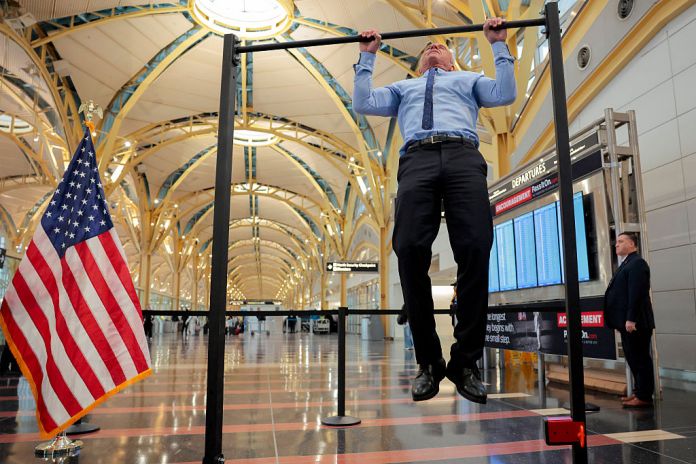 Human Services Secretary Robert F. Kennedy Jr. does pull-ups after a conference discussing the launch of the "Make Travel Family Friendly Again" campaign at Ronald Reagan Washington National Airport on December 08, 2025 in Arlington, Virginia. The campaign's focus is to incentivize family-friendly resources at airports. (Photo by Heather Diehl/Getty Images)