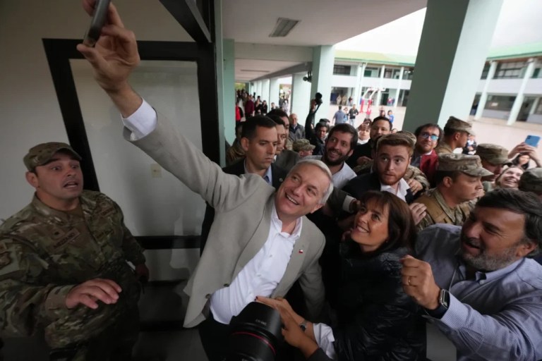 Jose Antonio Kast, presidential candidate for Chile's Republican Party, takes a selfie after voting in the 2025 presidential runoff election in Santiago.