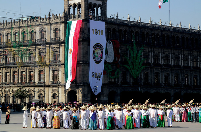 Members of the Mexican armed forces, dressed in revolutionary-era attire, participate in the Civic-Military Parade commemorating the 115th Anniversary of the Mexican Revolution in the Zocalo of Mexico City, Mexico, on Nov. 20. (Jose Luis Torales/NurPhoto via Getty Images)